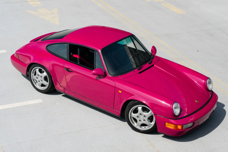 Pink sports car on a gray surface