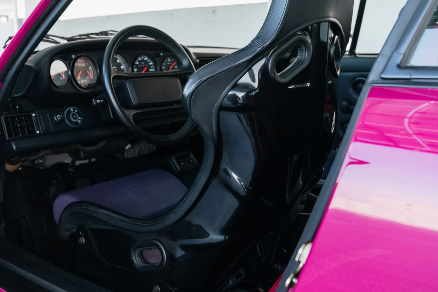 Close-up of a car's interior with a focus on the dashboard and steering wheel.